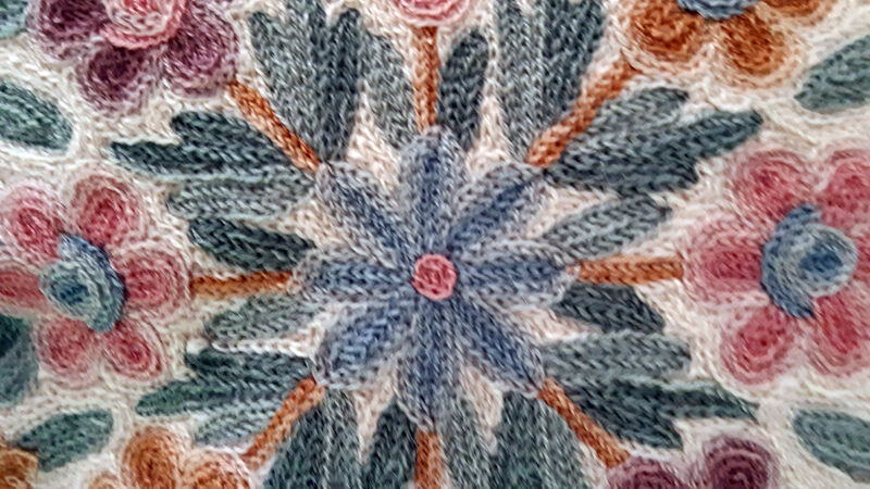 Set of three old hand-embroidered wool cushions