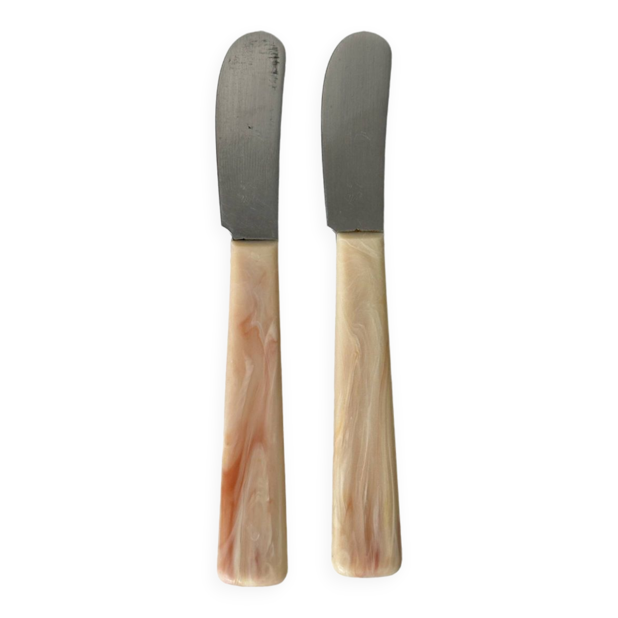 Pink bakelite butter knives.