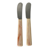 Pink bakelite butter knives.