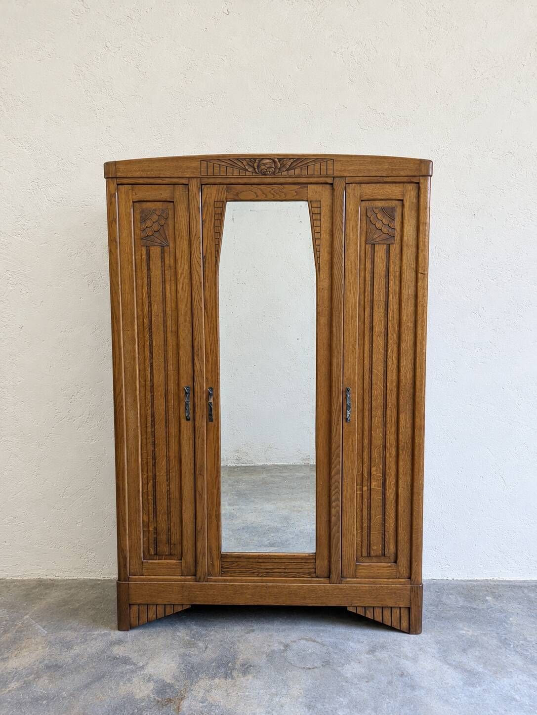 Art Deco oak wardrobe with three doors and bevelled mirror.
