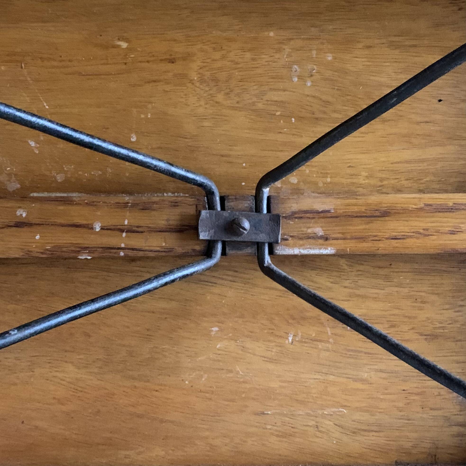 Old foldable fisherman's stool in wood and leather