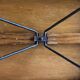 Old foldable fisherman's stool in wood and leather