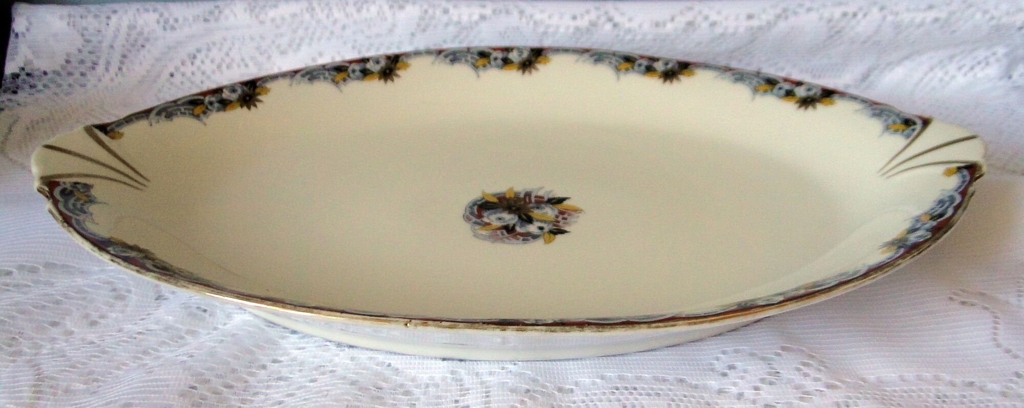 Large old oval dish in art deco porcelain