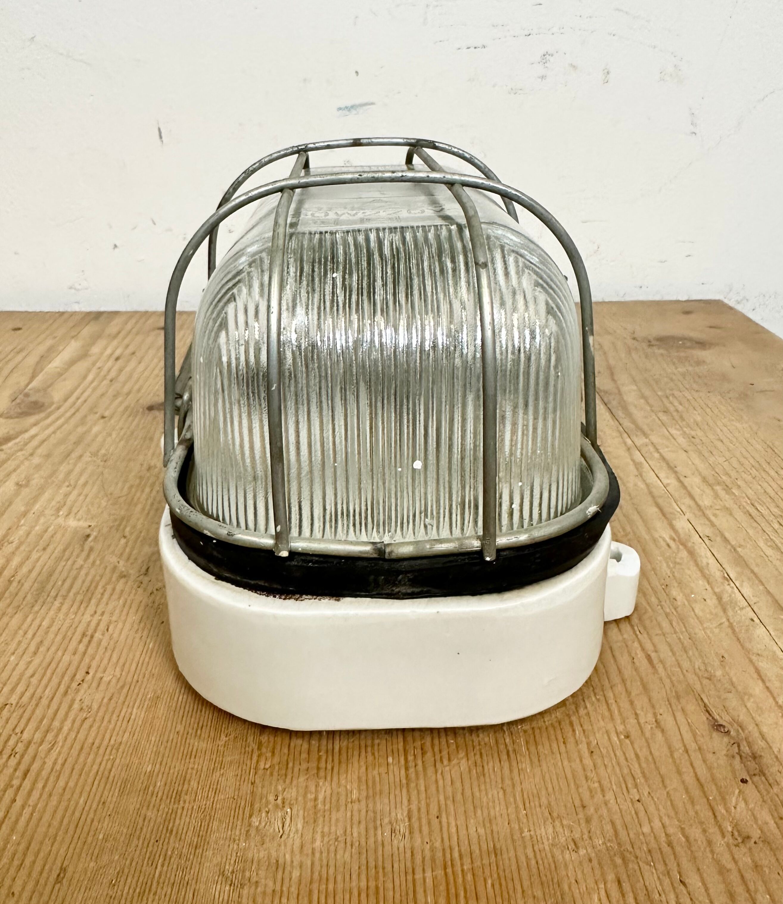 Industrial white porcelain cage wall light with ribbed glass, 1970s