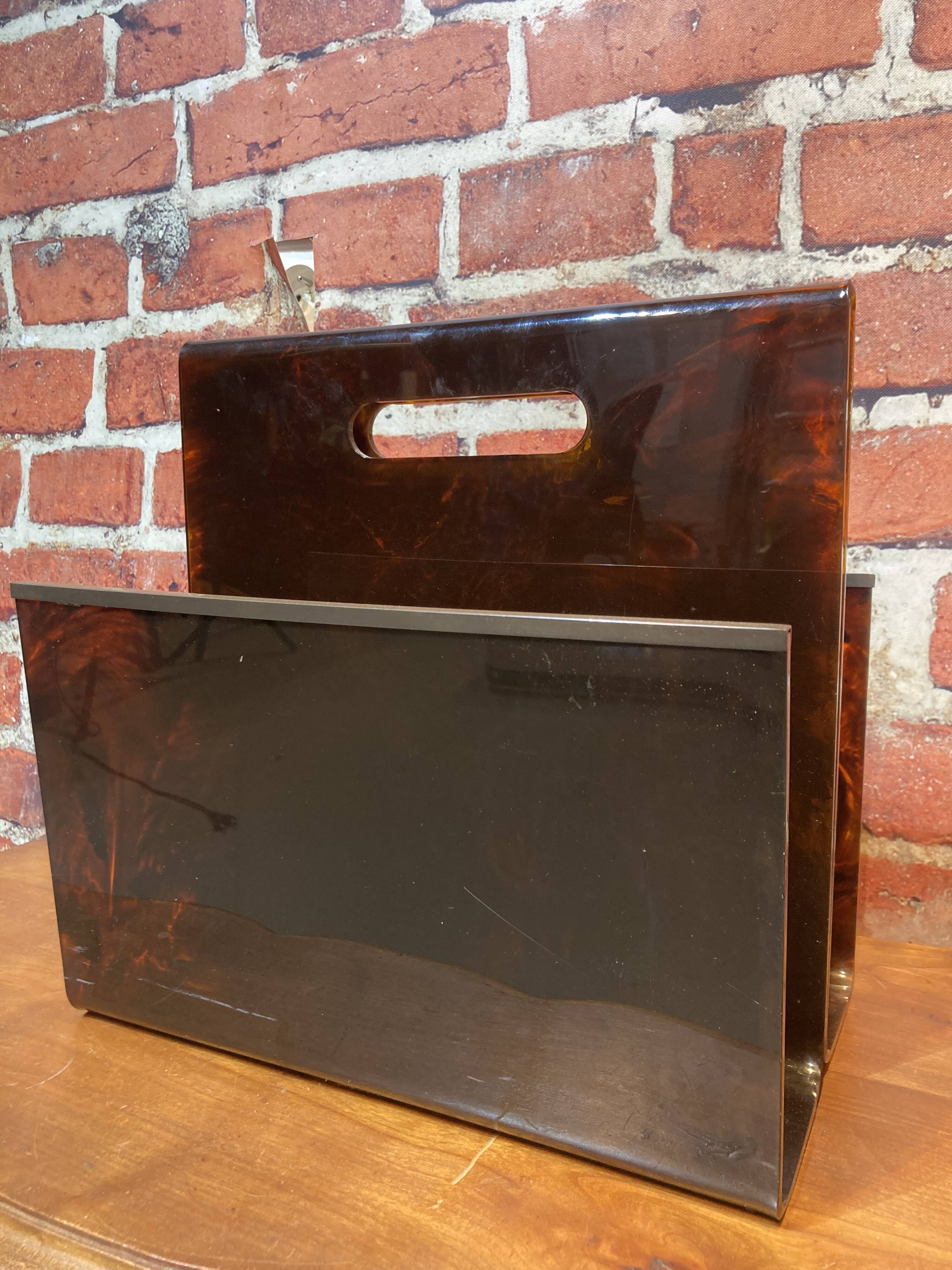 Brown plastic magazine holder with handle