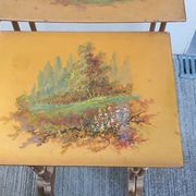 Sets of three nesting tables with painted landscape decorations in poplar.