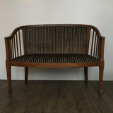 Old wooden and velvet bench