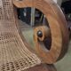 Colonial planter's armchair in solid teak, scroll armrests, caned seat.