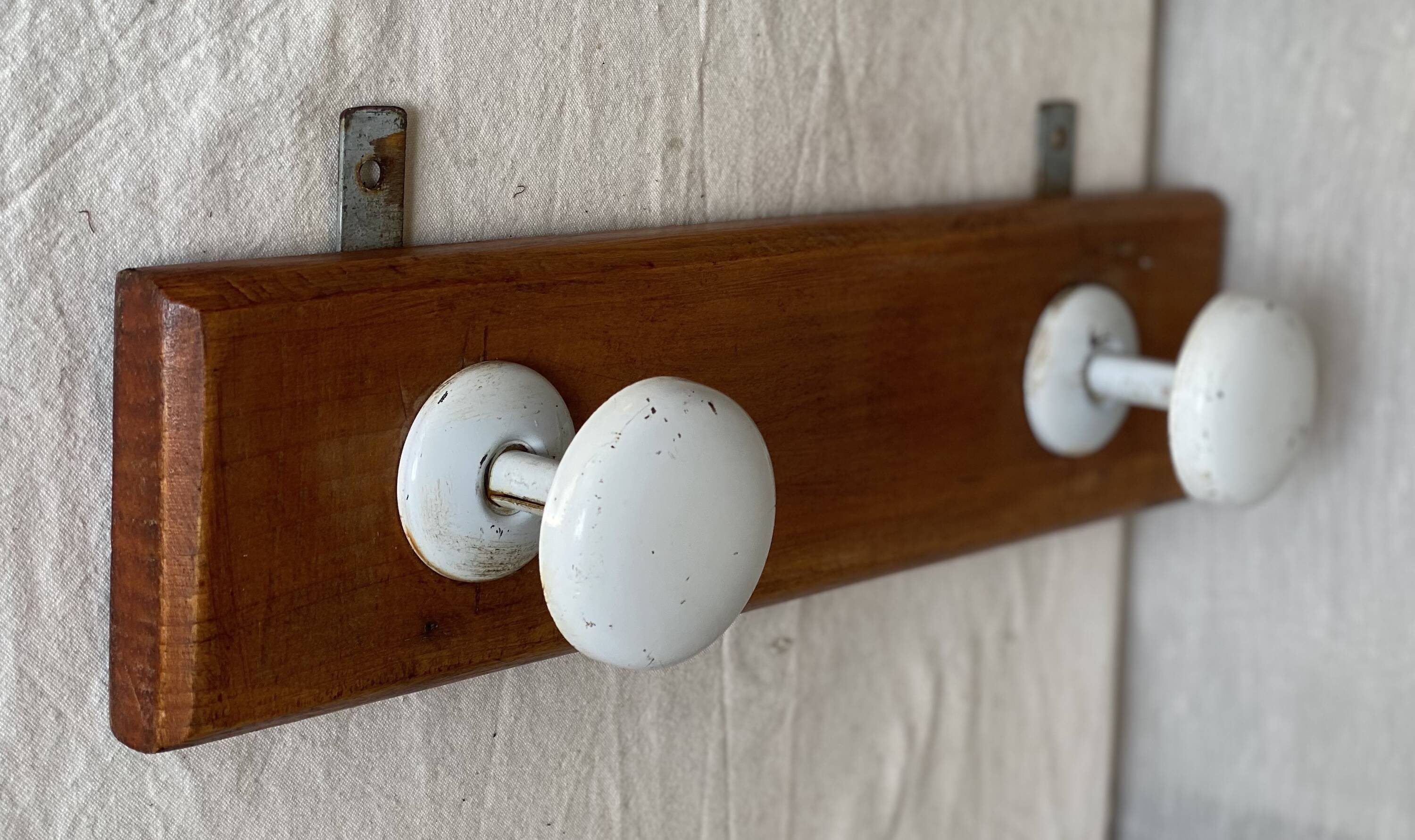 Wall-mounted coat rack with 2 hooks, vintage 1960s white lacquered metal.