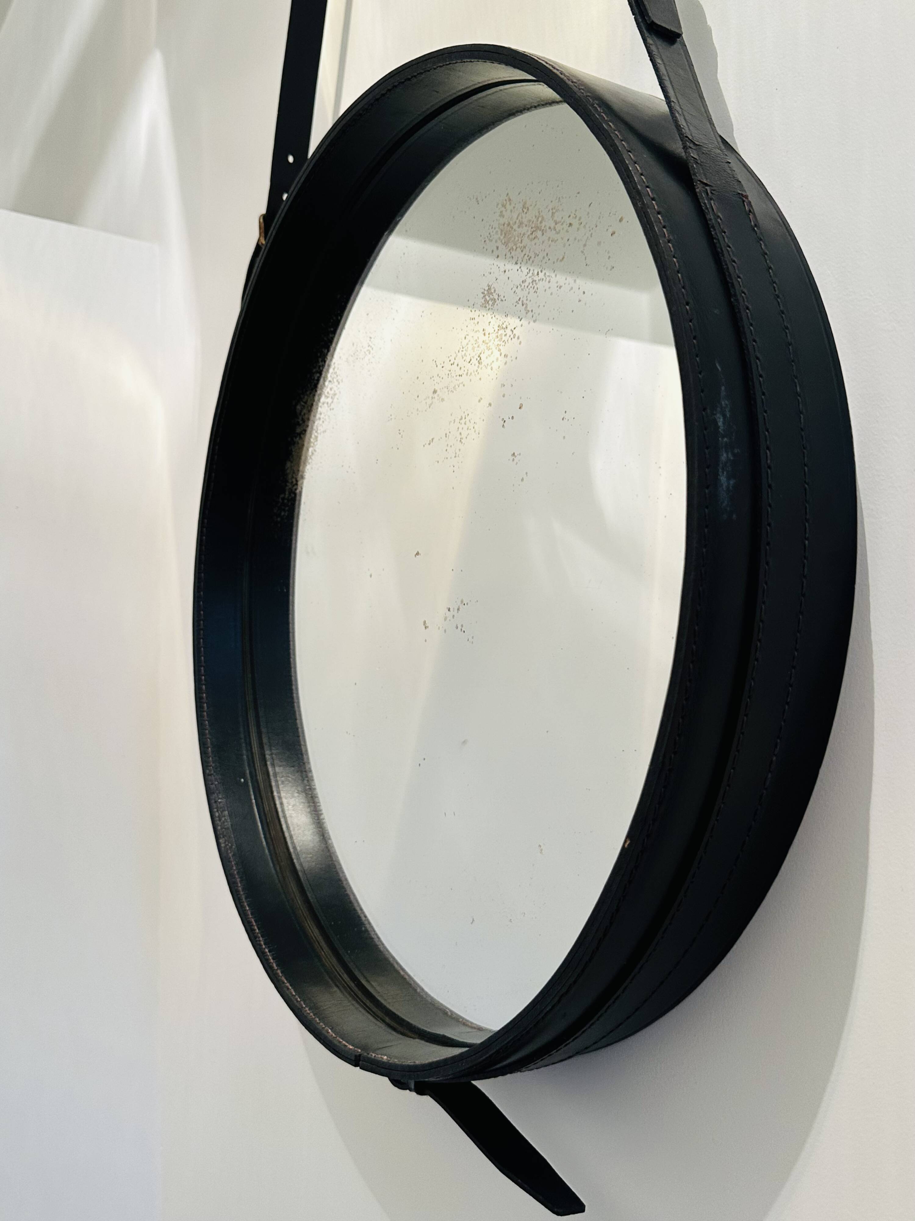 Jacques Adnet circular leather and brass mirror