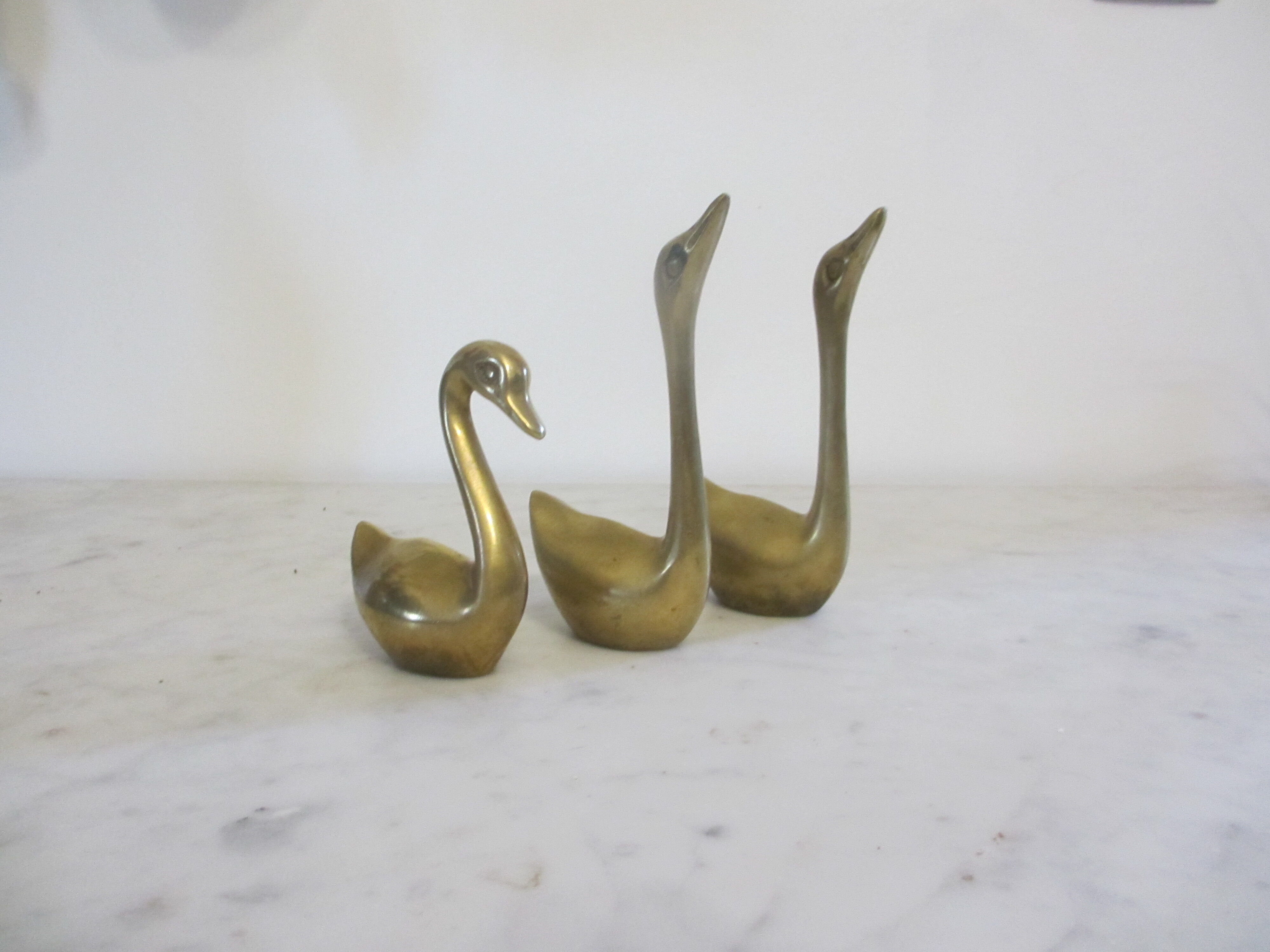 golden brass swans