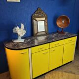 Vintage yellow sideboard, and black marble top.