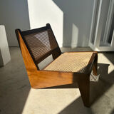 Reclined armchair in canned teak in natural wood