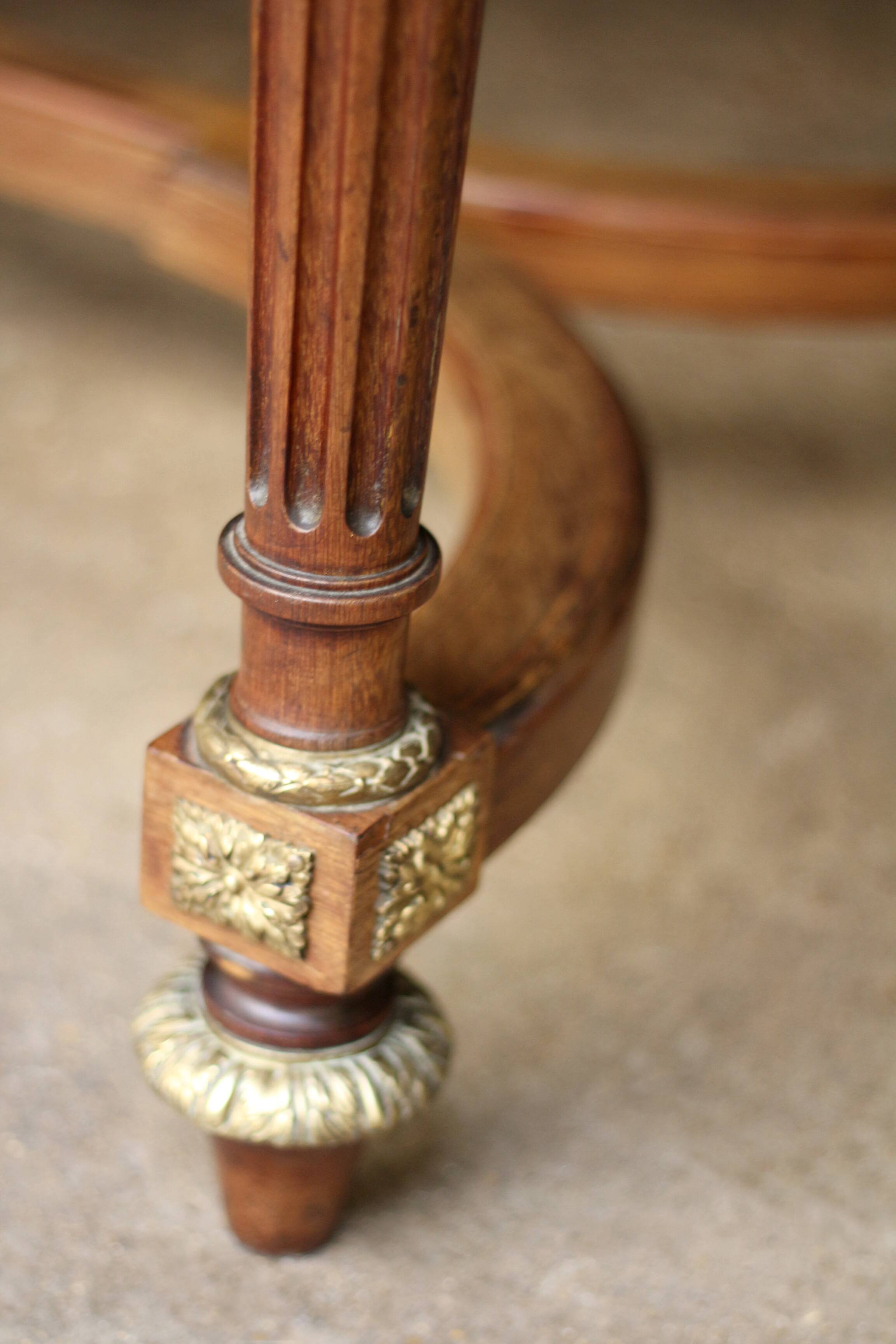 Superb Napoleon III table. Marquetry top and gilded bronzes.
