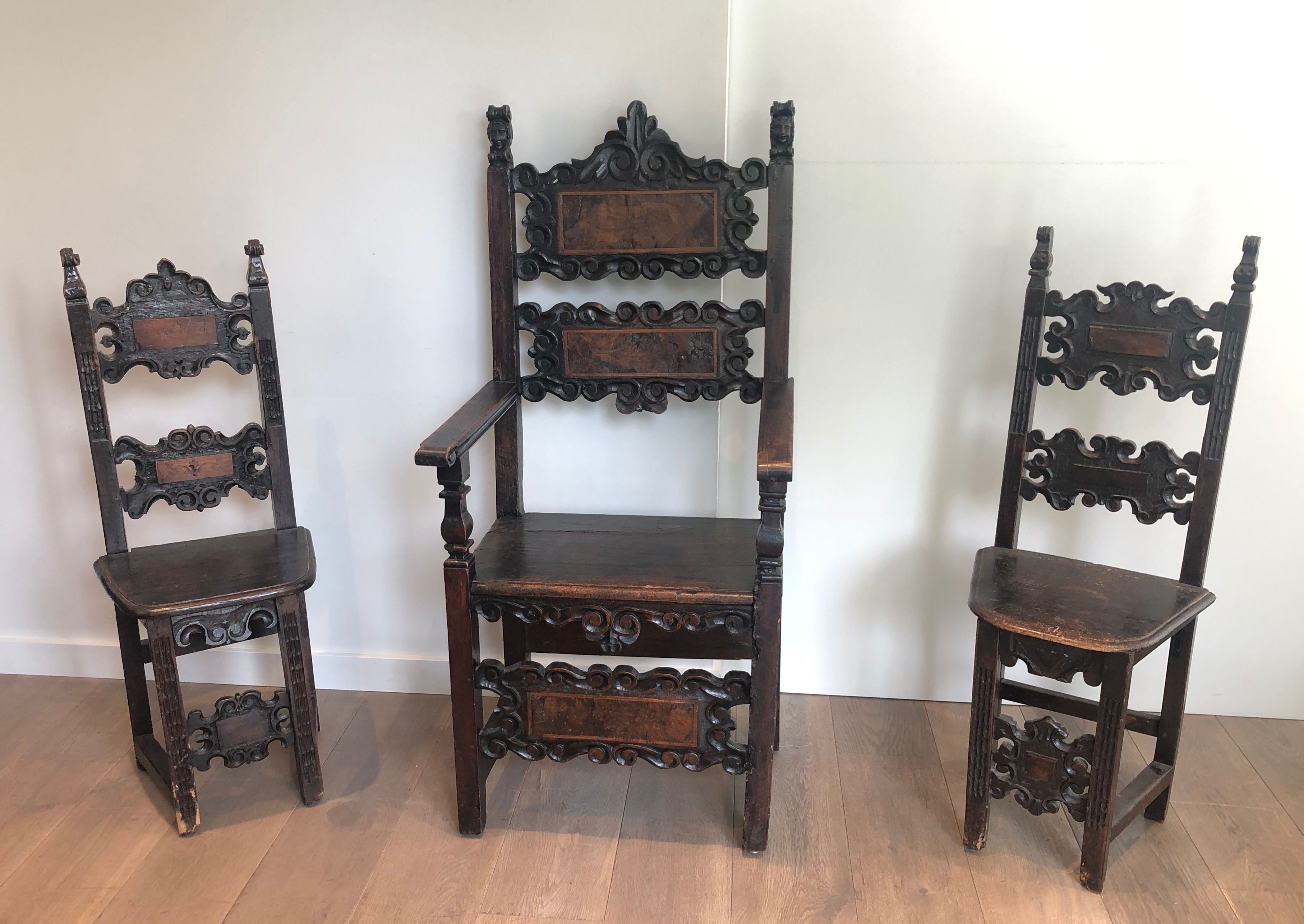 Set of an armchair and a pair of chairs in Italian Renaissance walnut