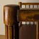Antique armchair in solid wood and patinated brown leather, early 20th century.