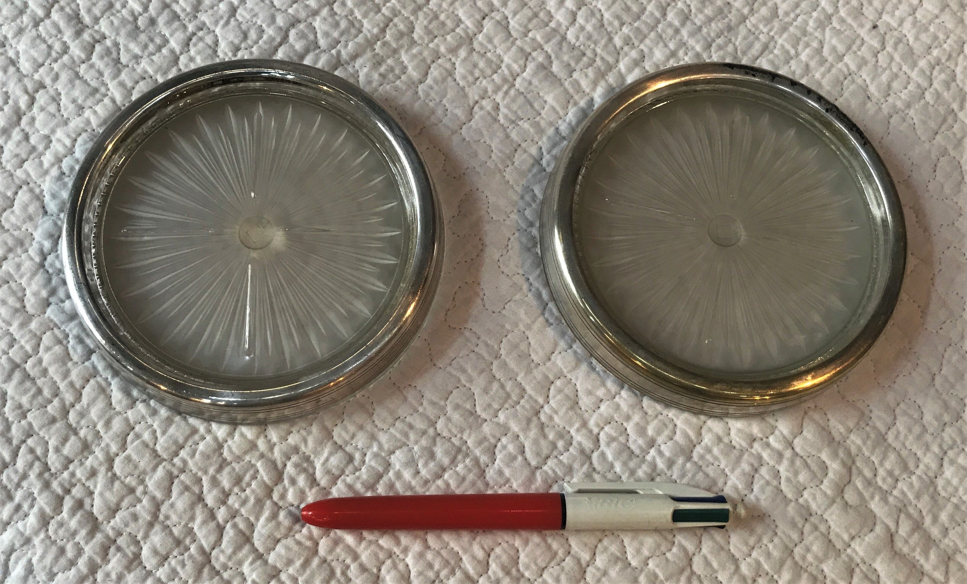 Pair of silver metal and glass bottle bottoms