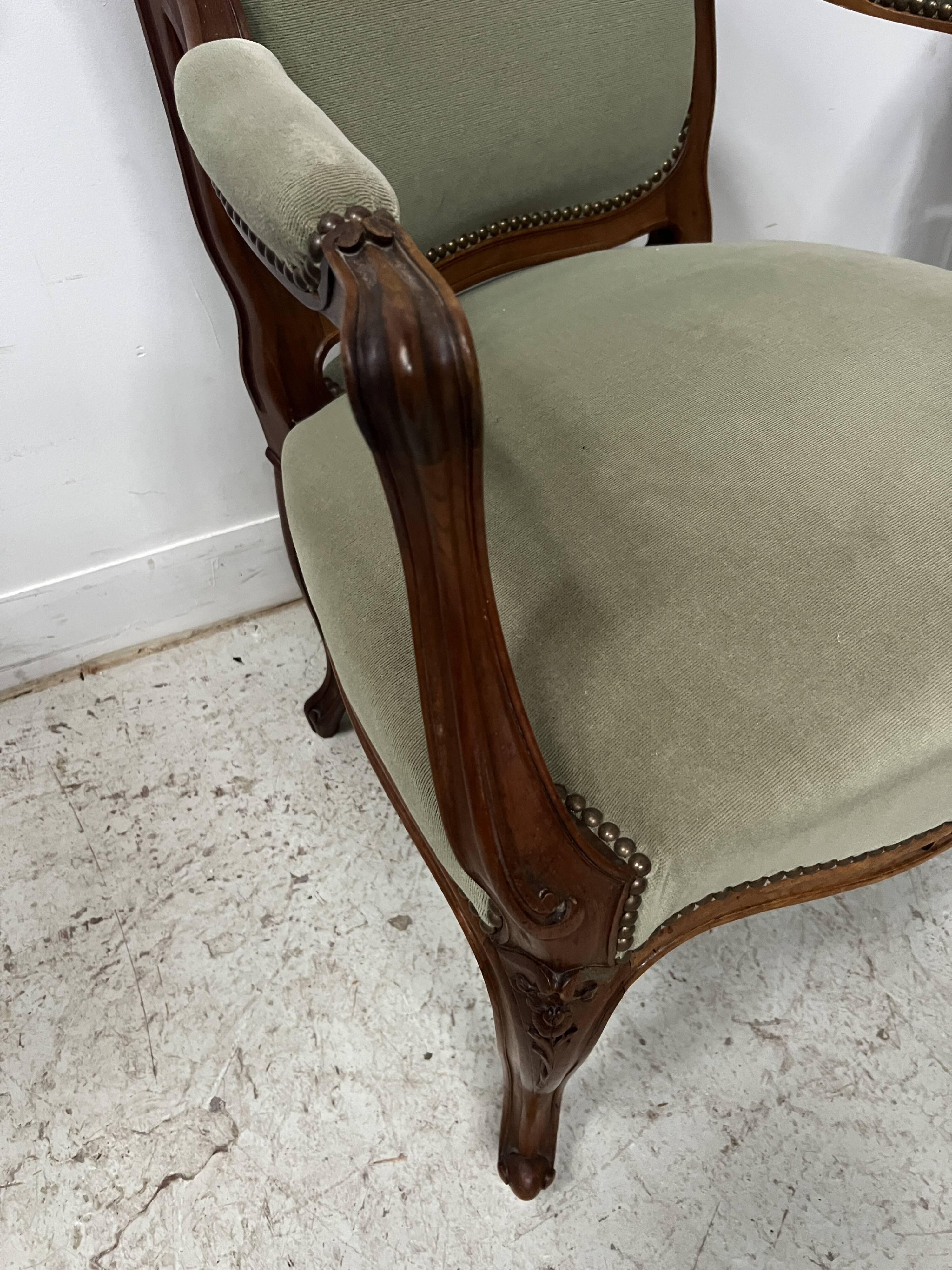 Pair of Louis XV style armchairs in solid walnut, 20th century.