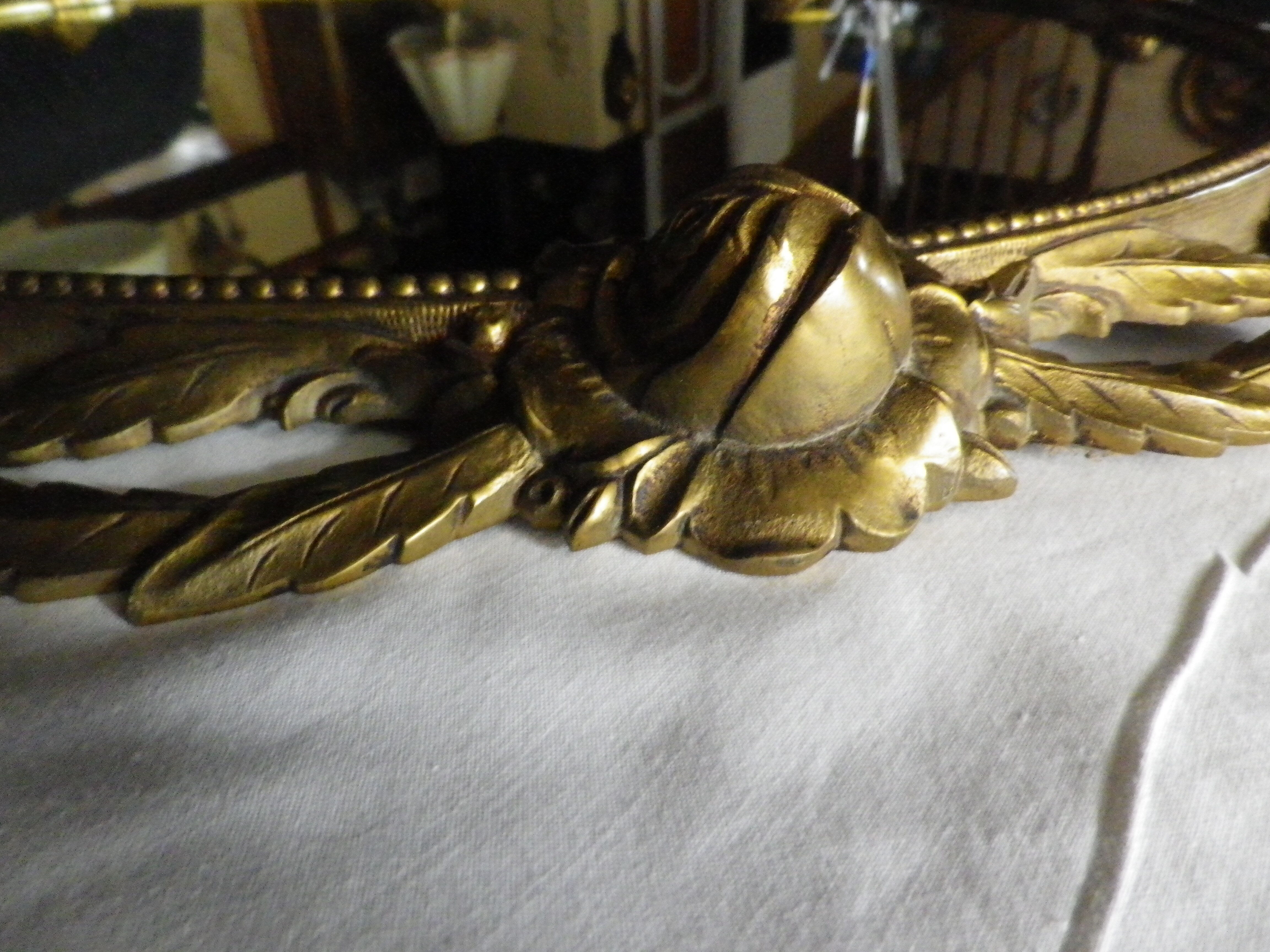 Bronze mirror gilded with roses, 72 cm