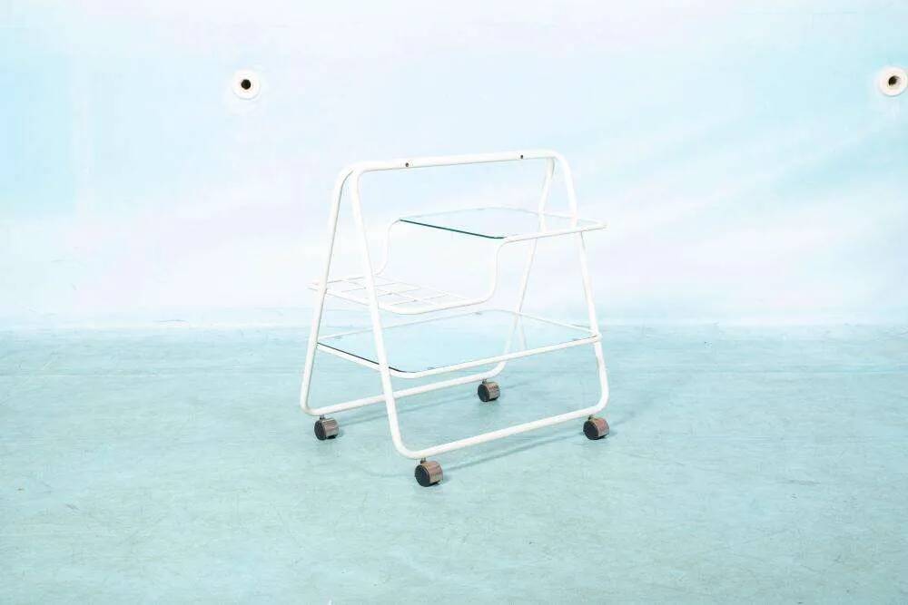 Space age dessert trolley from the 1970s, with metal tubes and glass trays.