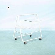 Space age dessert trolley from the 1970s, with metal tubes and glass trays.