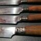 Old table knives and dessert knives, wooden handles, stainless steel blades