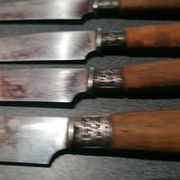 Old table knives and dessert knives, wooden handles, stainless steel blades