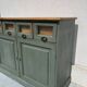Antique counter cabinet with drawers and label holders – green patina