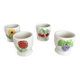 Quatre coquetiers vintage barbotine motifs fleurs et fruits porcelaine blanche