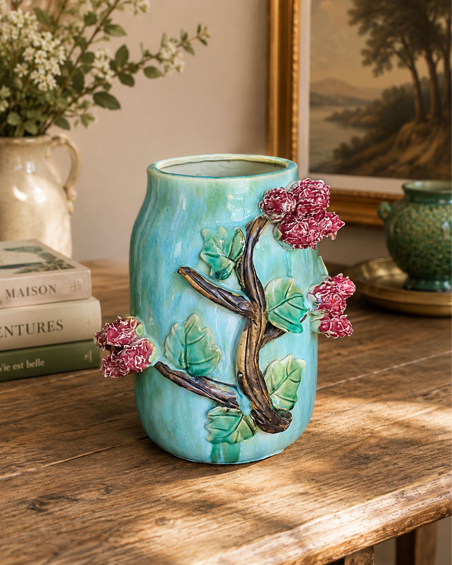 Large turquoise ceramic vase Athezza with raised floral decoration.
