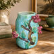 Large turquoise ceramic vase Athezza with raised floral decoration.