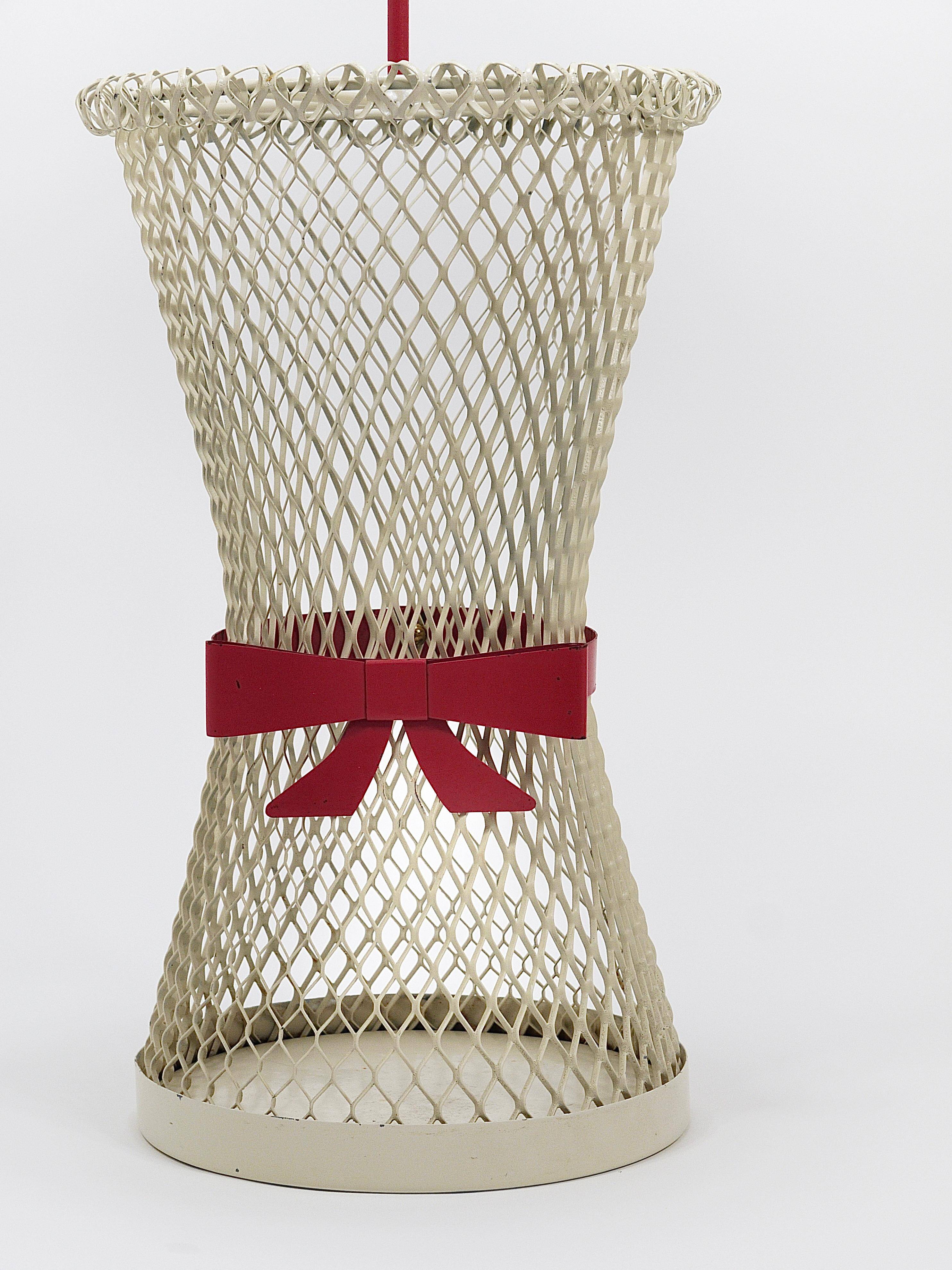 Bow tie umbrella stand in the style of Mathieu Matégot, mid-century, metal, France, 1950s.