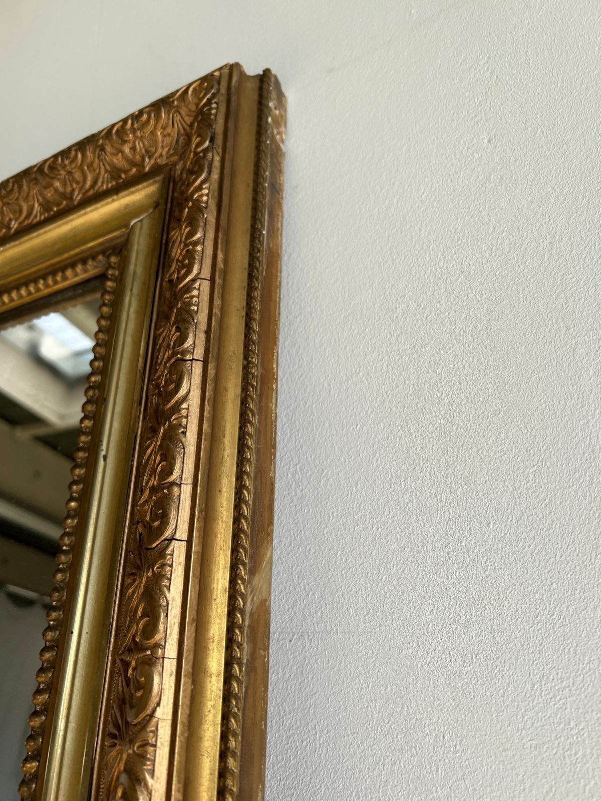 Gilded mirror with frieze h2m10 l:73cm