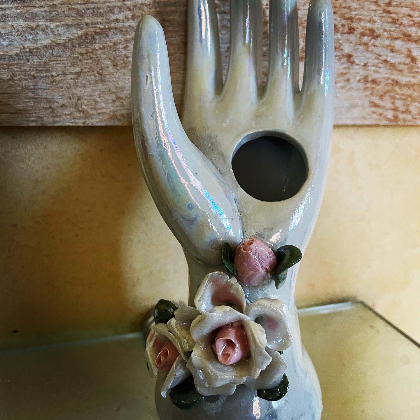 Hand holds jewelry or soliflore