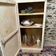 Small one-door Art Deco cabinet with a patina.