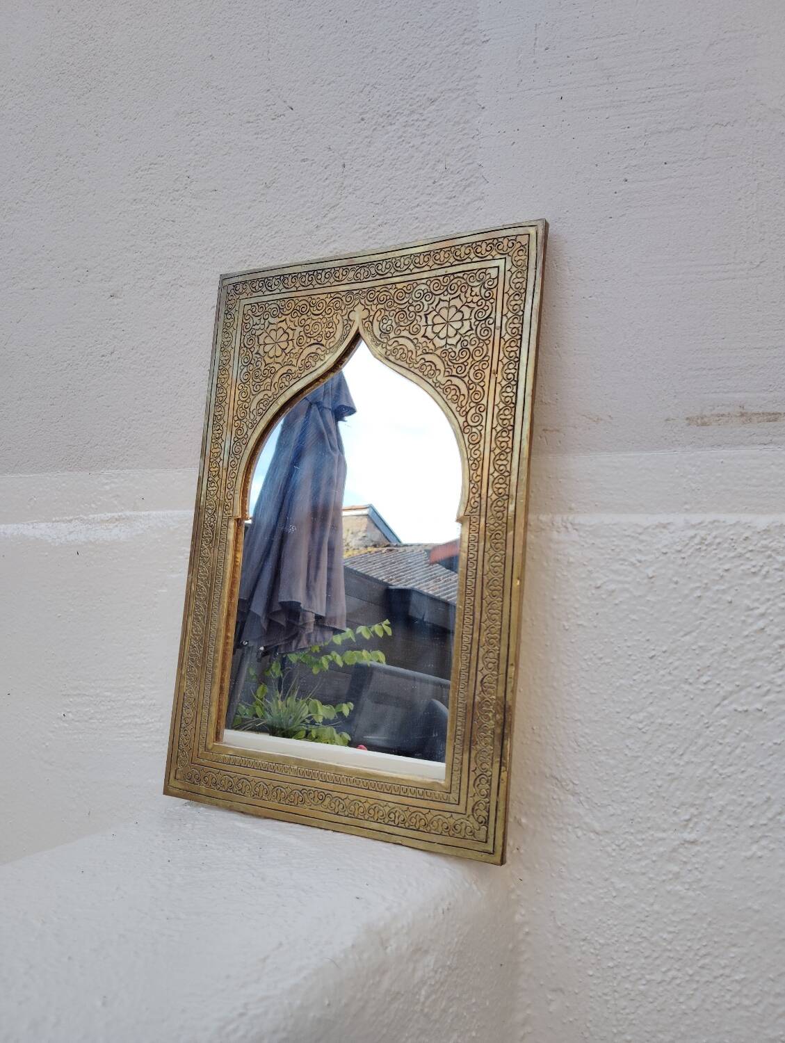 Golden oriental mirror