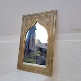 Golden oriental mirror