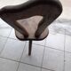 3 brutalist wooden tripod chairs
