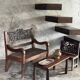Small antique Indonesian bench in carved teak with plant and floral motifs.