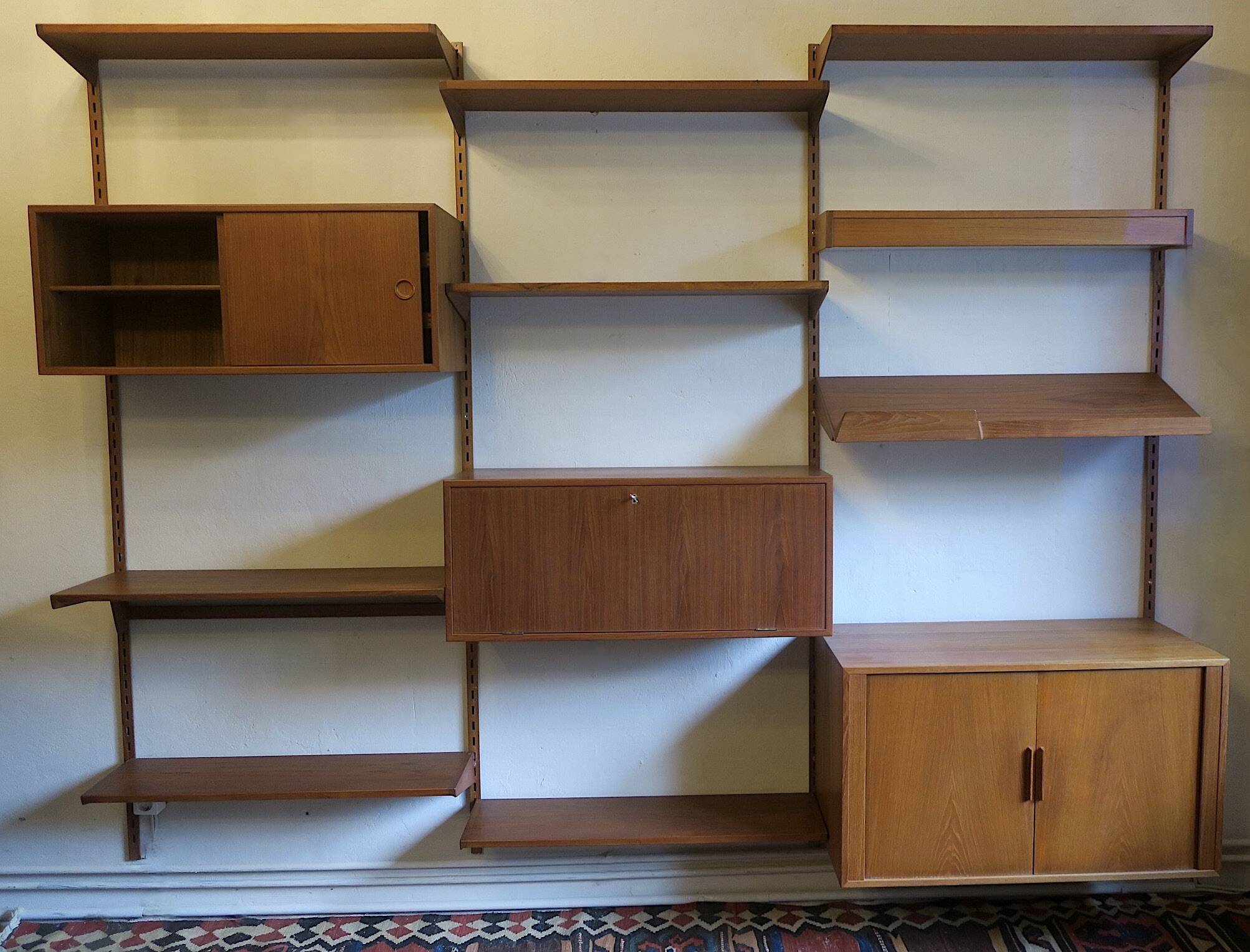 Modular 3-compartment teak wall shelving system with desk and lighting by Kai Kristiansen for FM, Denmark, 1960s