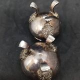 Pair of silver metal salt cellars with lion decor base
