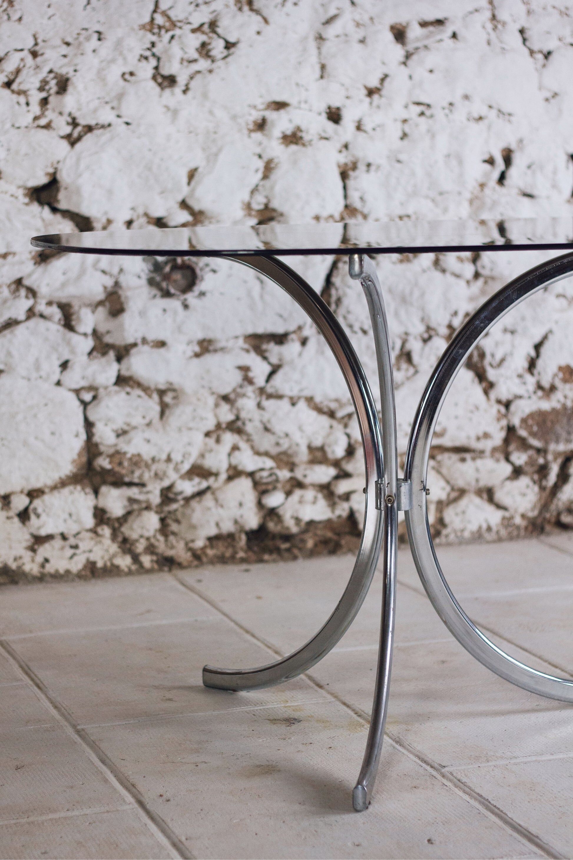 Chrome and smoked glass dining table in the style of Gastone Rinaldi, 1970.