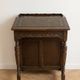 Antique wooden desk with a leather top.