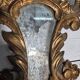 Italian mirror in gilded wood with gold leaf from the 18th century.