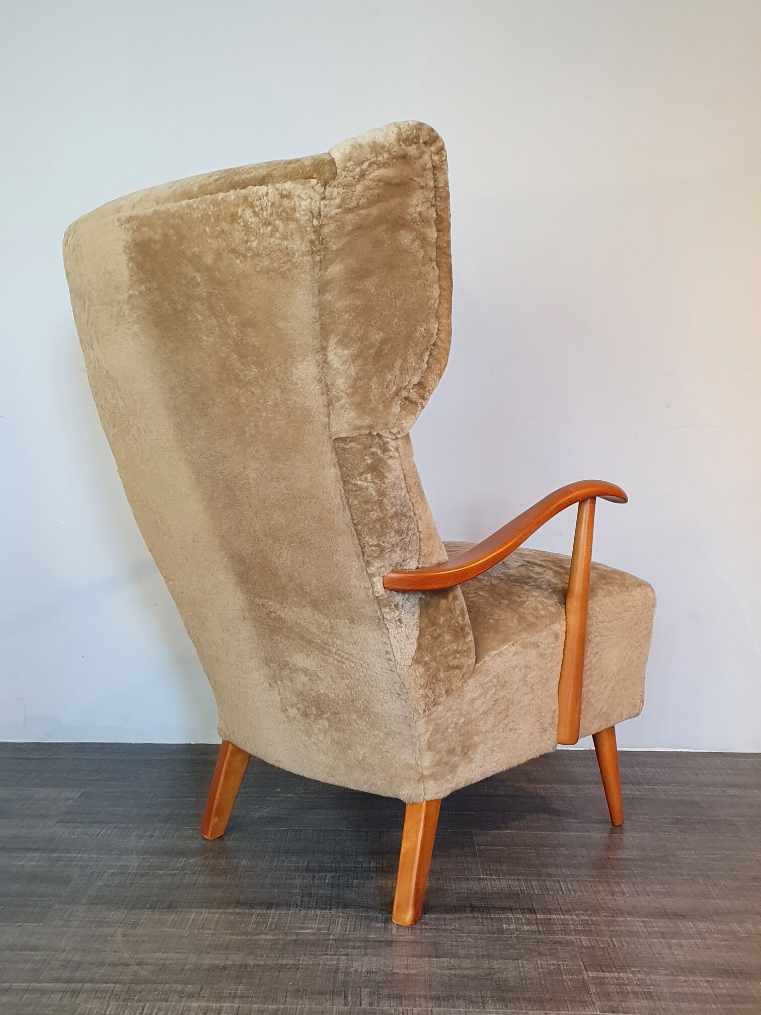Norwegian sheepskin wing armchair with ottoman 1950