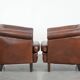 Unique set of two cognac-coloured cow leather club armchairs