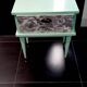 Vintage bedside table with compass feet