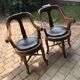 Pair of antique brown swivel armchairs in upholstery fabric, wooden frame, Hungary circa 1900.