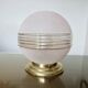 Plafonnier "globe" en verre granité rose,  liserés dorés, vers 1950 ou 1960