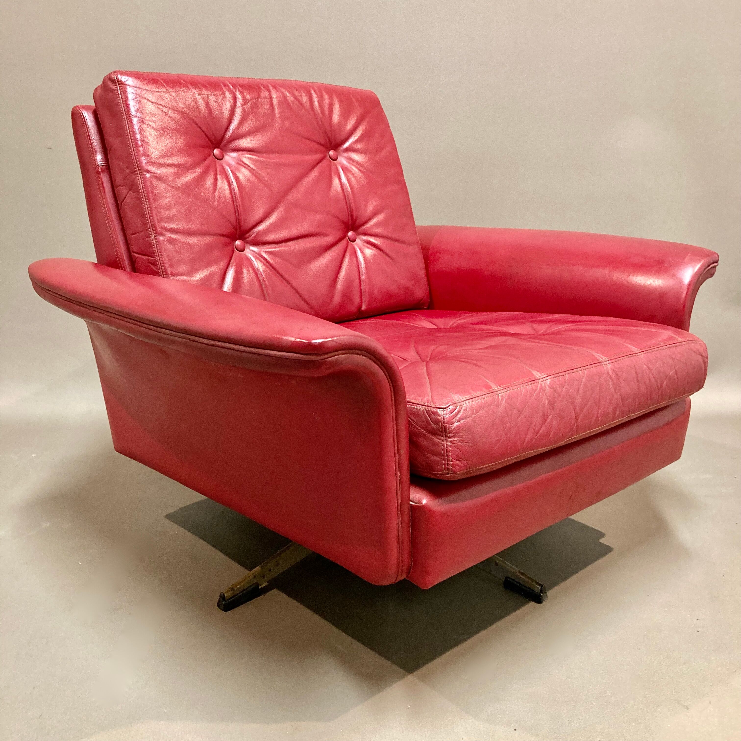 Red leather armchair design 1950